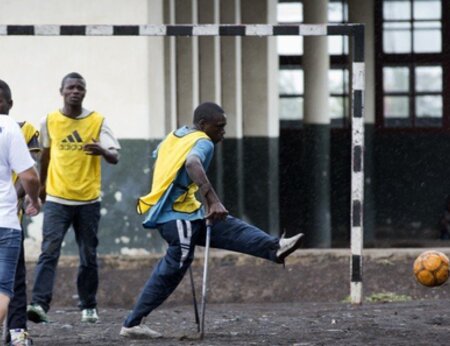 Children with disabilities play the first game during the launching of a new soccer school in Goma’s Don Bosco college, the 24th of April 2014.