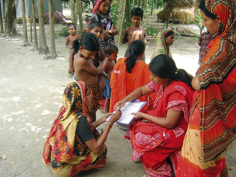 A researcher gains informed consent from a research participant in Bangladesh. From Community Eye Health.